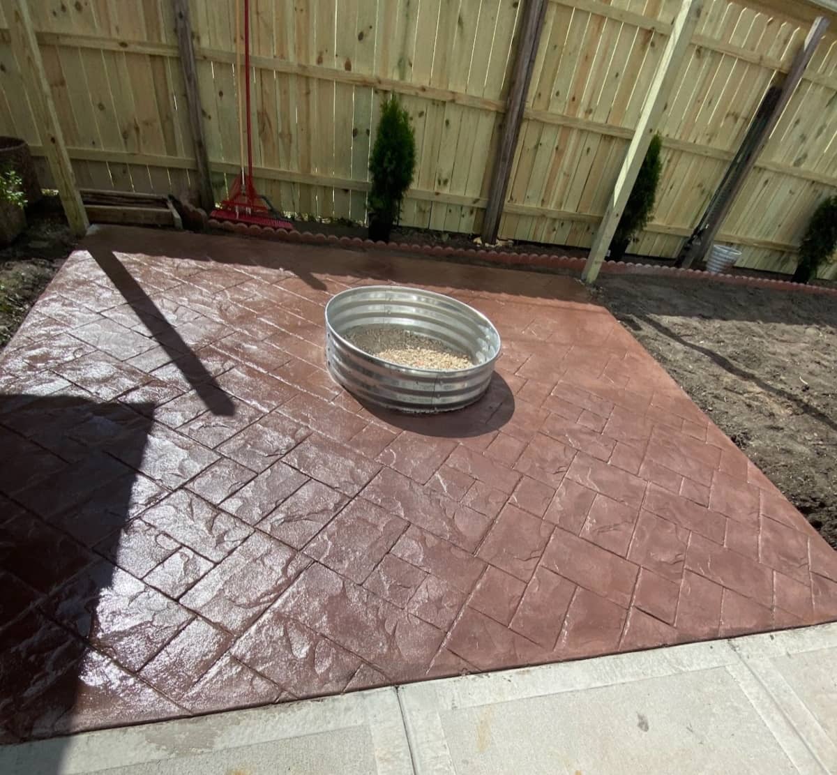 Red stamped and colored concrete patio